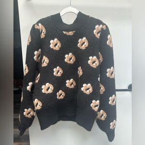 Lush Black Sweater with Floral Accents